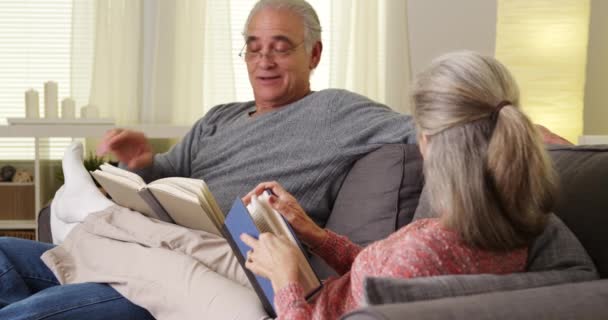 Mature Couple Sitting Couch Reading Books — Stock Video