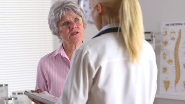 Older Patient Talking Female Doctor — Stock Video