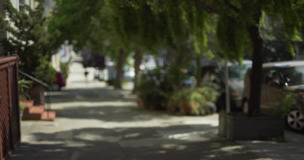 Exterior Shot Downhill Neighborhood Lined Suburban Apartments Blurred View Sidewalk — Stock Video