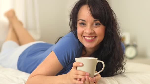 Young Hispanic Woman Lying Bed Mug — Stock Video
