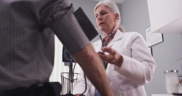 Middle Aged Male Patient Having Blood Pressure Checked — Stock Video