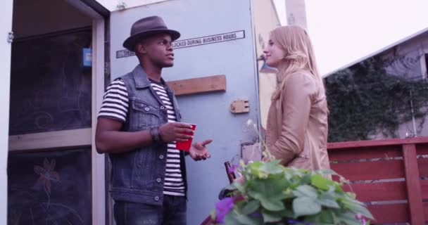 Cute Young Black Caucasian Hipster Couple Talking Doorway Party Drinking — Stock Video