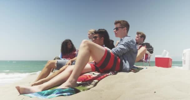 Hip Young Group Multi Ethnic Friends Sitting Talking Beach — Stock Video