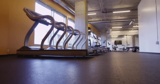 Hispanic Woman Leaving Gym Workout Walking Row Treadmills — Stock Video