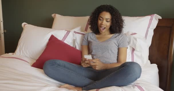 Happy African Woman Using Smartphone Bed — Stock Video