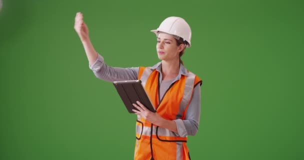 Young Woman Construction Manager Directing Traffic Front Project Green Screen — Stock Video