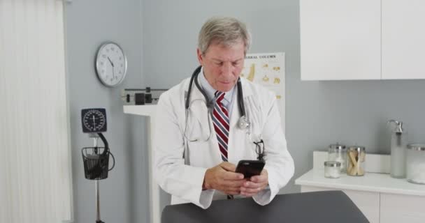 Mature Doctor Using Smartphone Office — Stock Video