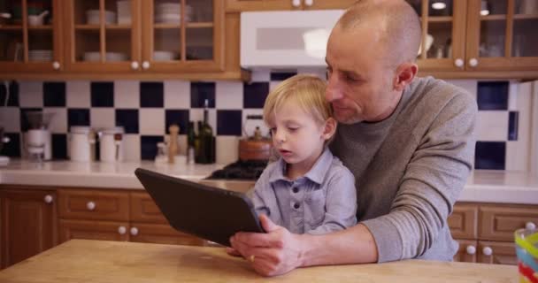 Good Looking Caucasian Father Teaching Cute Young Son Tablet — Stock Video