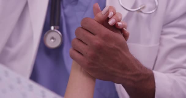 Black Doctor Holding Patient Hand — Stock Video