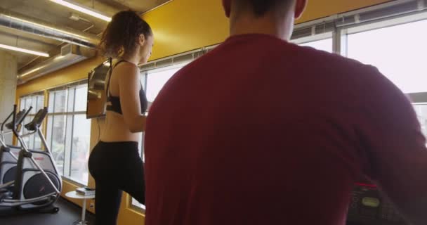 Hispanic Woman Smiling Chatting Black Boyfriend Gym While Working Out — Stock Video