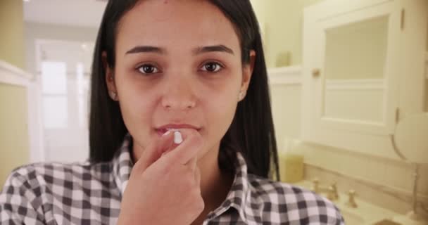 Young Hispanic Woman Taking Medication — Stock Video