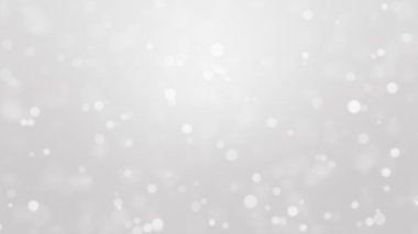 Silver festive animated background with glowing bokeh light particles.