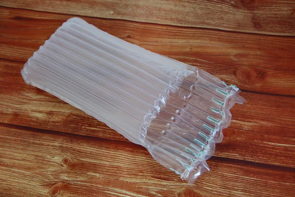 Embalaje Inflable Plástico Prueba Golpes Aire Fondo Madera —  Fotos de Stock