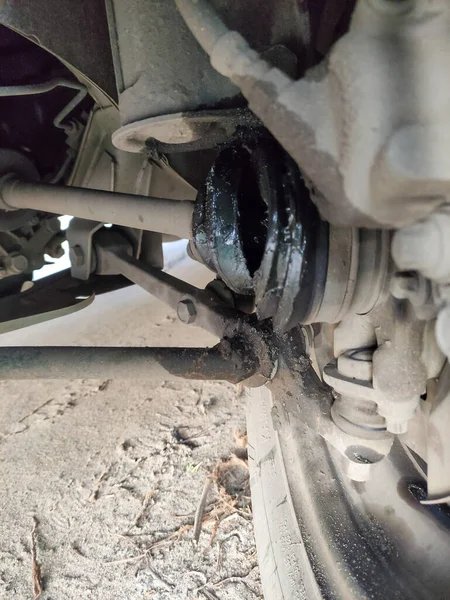 Broken Joint Car Casing Burst Lubricant Flows Vertical Photo Stock Photo