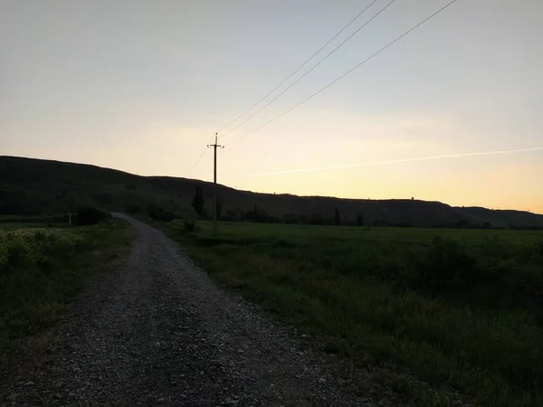 Elektrisk Stolpe Form Ett Kors Vid Solnedgången Mot Bakgrund Ett — Stockfoto