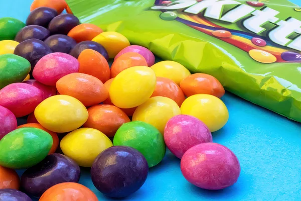 Kosice, Slovakia - July 20, 2022:Skittles is a brand of fruit candy currently manufactured and marketed by the Wrigley Company, a division of Mars, Incorporated. They have a hard candy wrapper that be.
