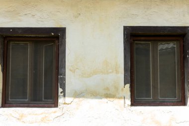 Wooden windows on an old village house.