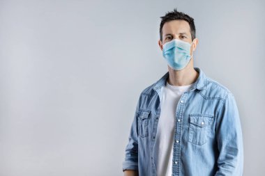 Portrait of Caucasian Man wearing protective surgery face mask.