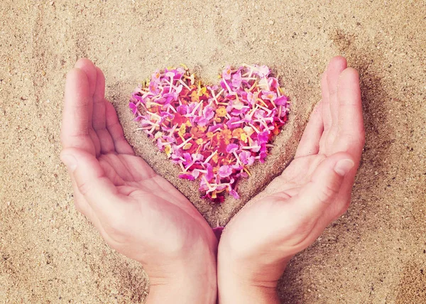 Heart Pink Petals Tropical Flowers Sand Female Hands Close Top — Stockfoto