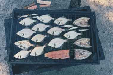 Fish Smoking Process. Smoked flounder. Close Up Smoking. View from above, soft focus