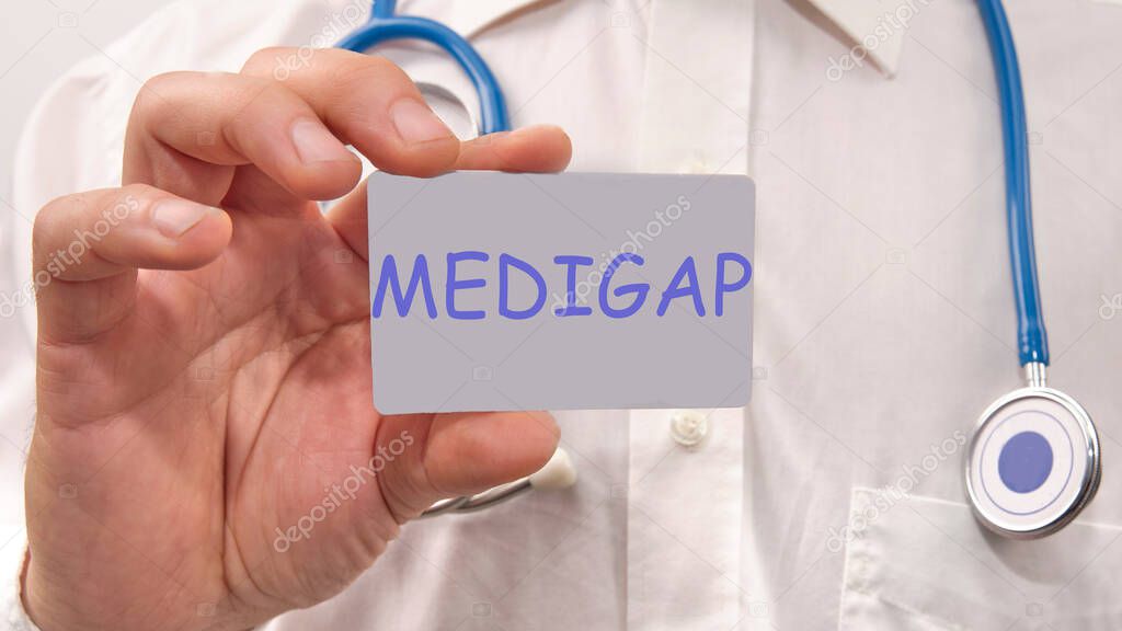 medigap written on the doctor's card. Medical concept.