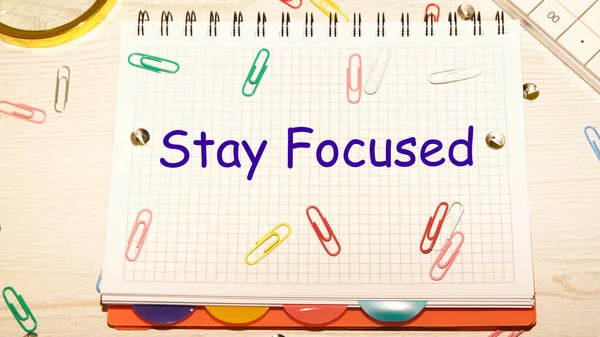 Stay Focused Text Notebook Cage Scattered Paper Clips Notebook Table — Stock Photo, Image