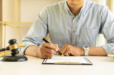 Lawyers work with hammers and scales in the office with tiger skins. justice concept judge Consultation and talks at the law firm concept of law The judge uses the scales of justice.