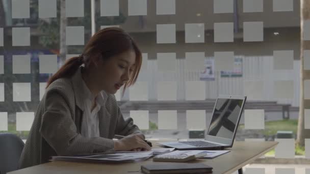 Asian Woman Working Financial Accounting Office Laptop Graphing Documents Computational — Stock Video