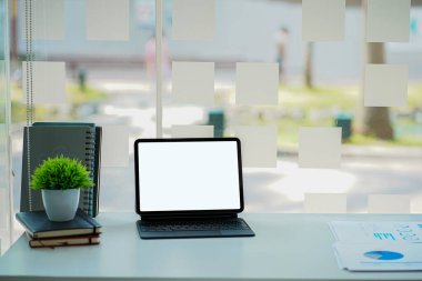 business concept, document, financial graph and a tablet with a calculator on the desk in the office