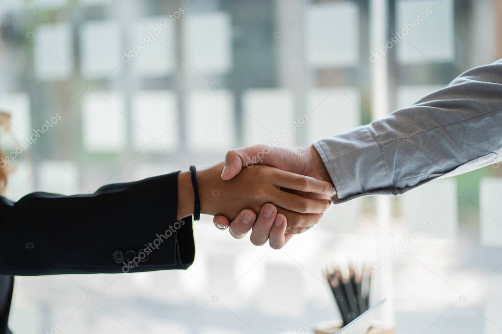 Good deal. Businessmen shake hands. With colleagues agree to do business together. goal achievement and expand the online digital commerce market around the world immediately