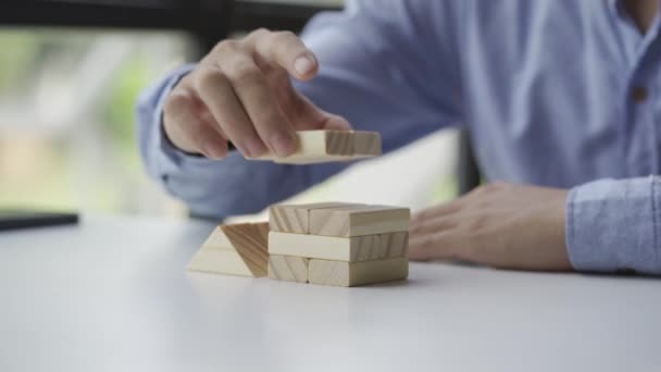 Businessman Hand Holding Domino Placed Wooden Tower Successful Business Growth — Stock Video