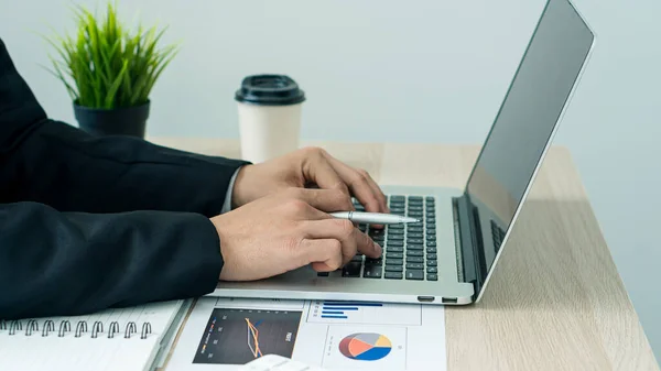 businessman hands working on laptop computer data analysis financial chart review online work concept
