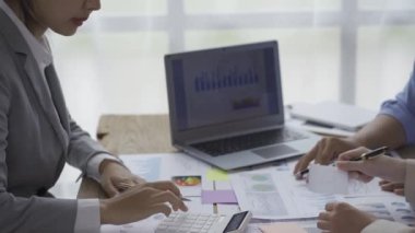 small group of young people at a business meeting a team in a modern office planning of work design and brainstorming ideas Hands of a businessman working on documents and laptops Video 4k
