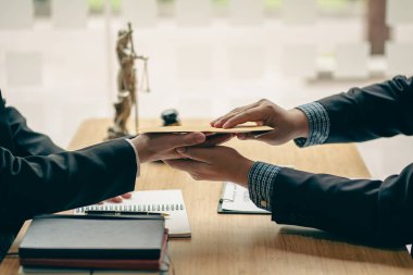 Illegal bribery concept Businessman offers bribes to lawyers to help win court cases. Bribery and Kickback Ideas Fraud and Fraud