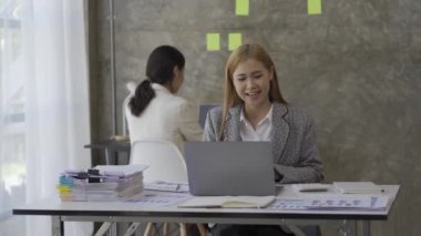 A businesswoman uses a calculator to work on financial reports. start a new business on the table with a cup of coffee and a data sheet Small Business Finance Ideas 4k Video
