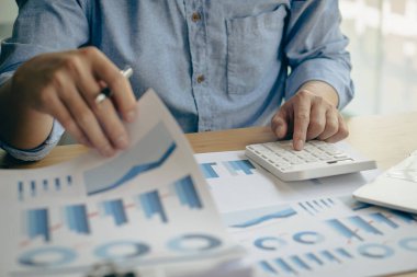 The company's accountant analyzes the expenses on the business desk. financial reporting accountant computer with graph chart business idea Finance and Accounting