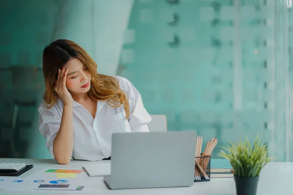 Asian Businesswoman Having Headache Work Analyzing Financial Graphs Laptop Office — Stok fotoğraf