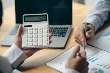 team work process Businessman working in the office discussing paperwork and working on financial reports. Talk about an investment business plan. financial analysis concept