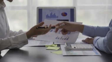 Businessman teamwork and brainstorming people who analyze and talk Strategic plan for corporate project, business team, check the financial graph. Colleagues check documents at the desk.