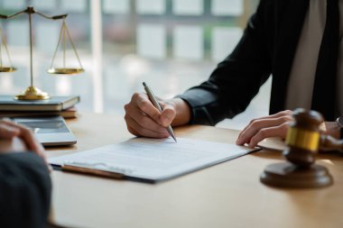 Lawyer who works law at work for a consultant lawyer idea with a hammer put forward.