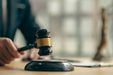 Lawyer who works law at work for a consultant lawyer idea with a hammer put forward.
