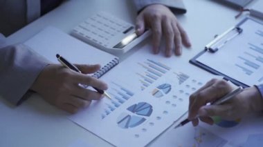 Two businessmen agree on the company budget. Meeting the current business team professional investor Work with a finance manager job. and two colleagues discussing 4k finance