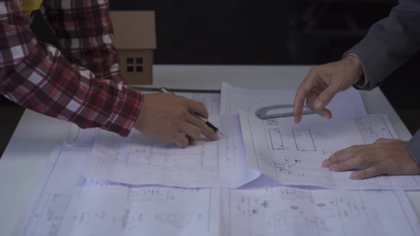 Team Designers Works Sitting Desk Office Employees Seriously Discuss Blueprints — Stockvideo