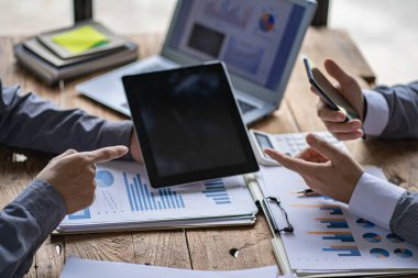 Business team meetings to work together to discuss financial data analysis and marketing business strategy projects. Presentation and brainstorming for profitable company at the office desk.