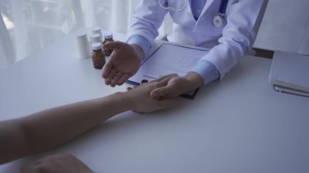 Video Young Male Doctor Holding Patient Hand Give Advice Encouragement — Vídeos de Stock