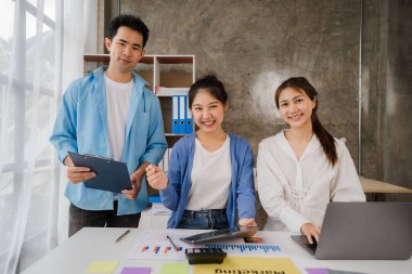 Young Asian businessmen meet in office to write memos. Strategic Planning and Brainstorming Starting a business, the idea of a colleague