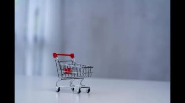 The moving coin pile in the cart increases proportionally. business growth idea