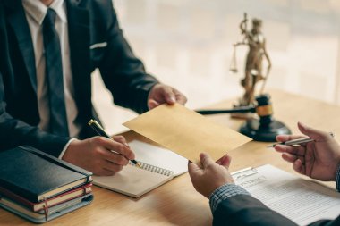 business law concept lawyer business Consultation between male lawyers and business clients The company provides tax and legal services and discusses contract documents between male lawyers 