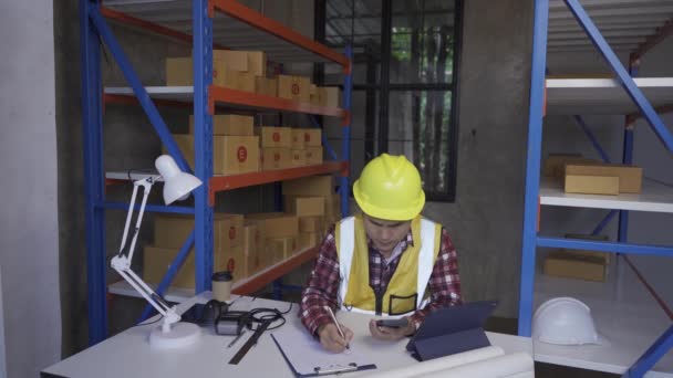 Young Manager Checking Stock Clipboard Warehouse Side View Young Asian — Wideo stockowe