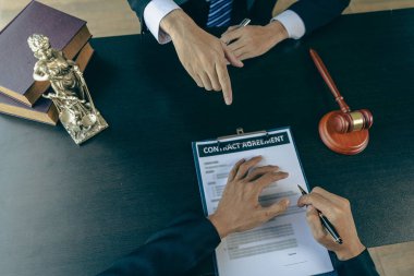 Judge and Hammer are in front of the Attorney Justice team meeting at the law firm. Legal concepts and document consulting services